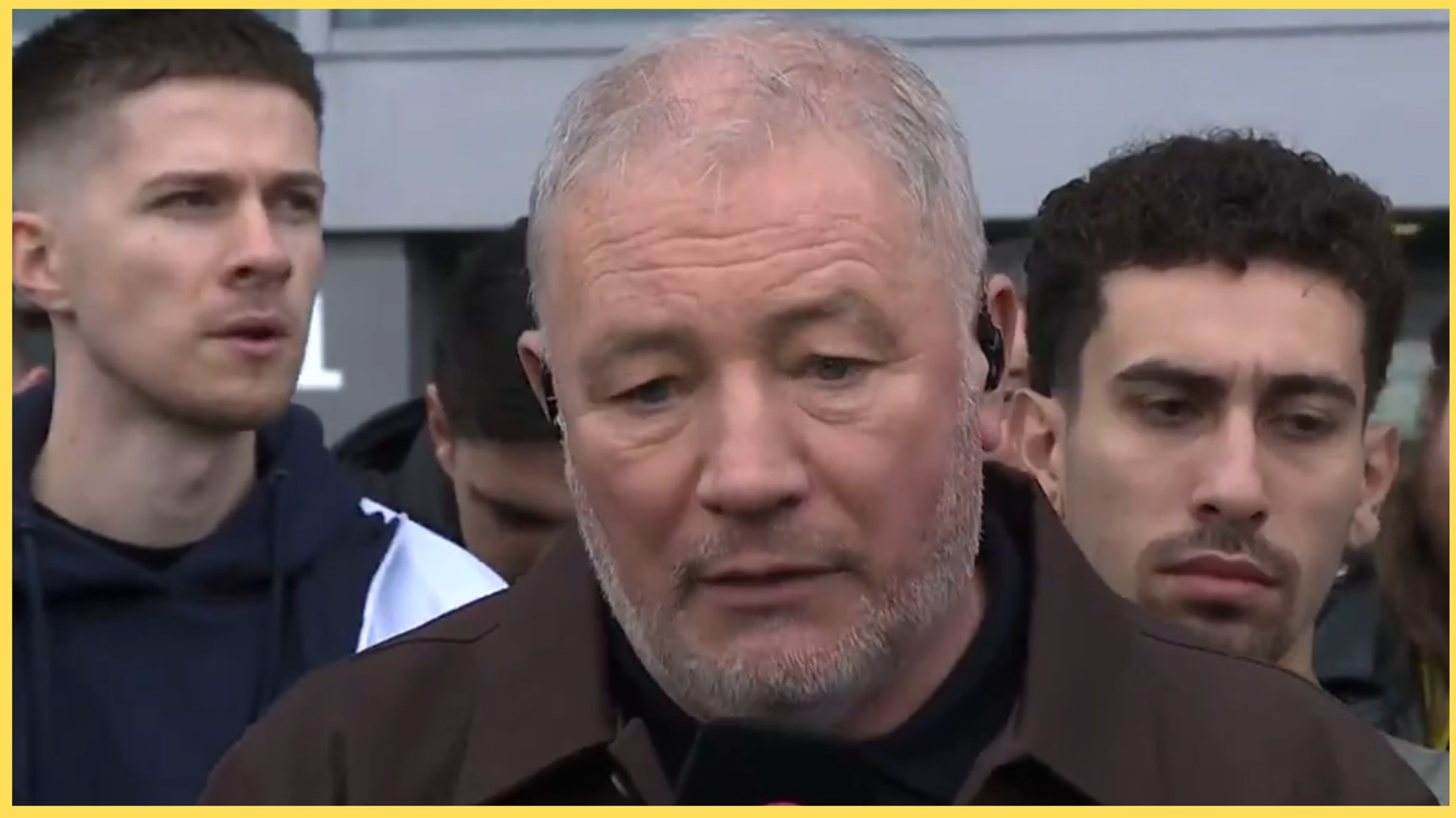 Ally McCoist speaks into a microphone during TNT Sports interview.