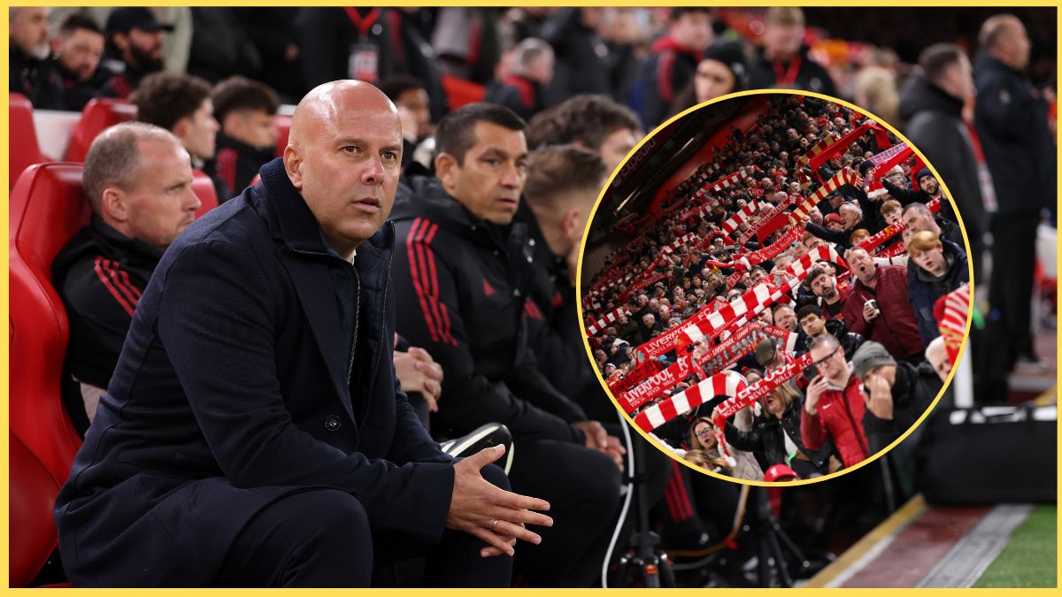 Arne Slot sits on the bench next to picture of Liverpool fans.