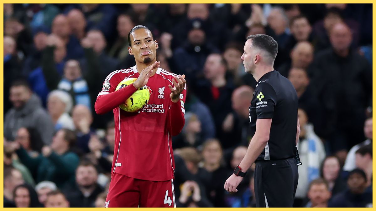 Virgil van Dijk of Liverpool reacts towards Referee Chris Kavanagh