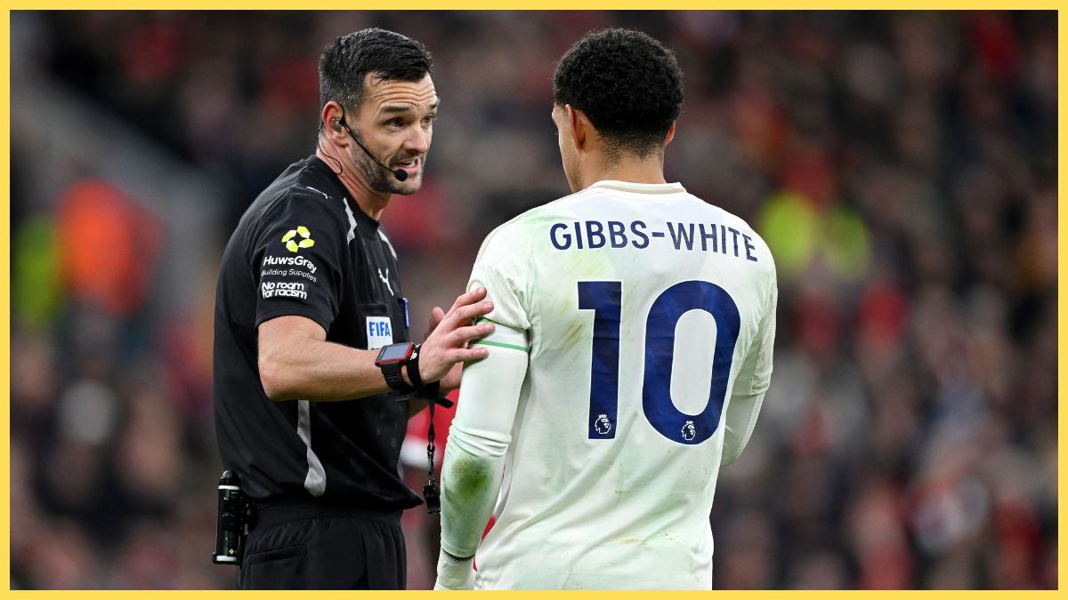 Andrew Madley interacts with Morgan Gibbs-White at Anfield