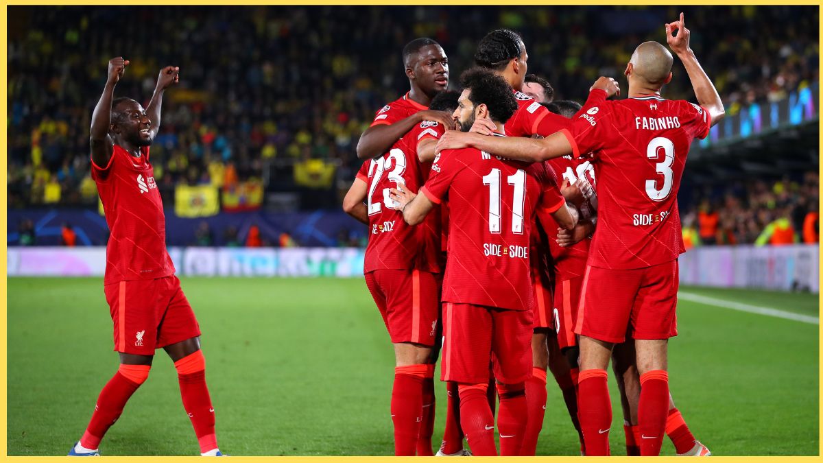 Naby Keita celebrates with Liverpool teammates in 2022