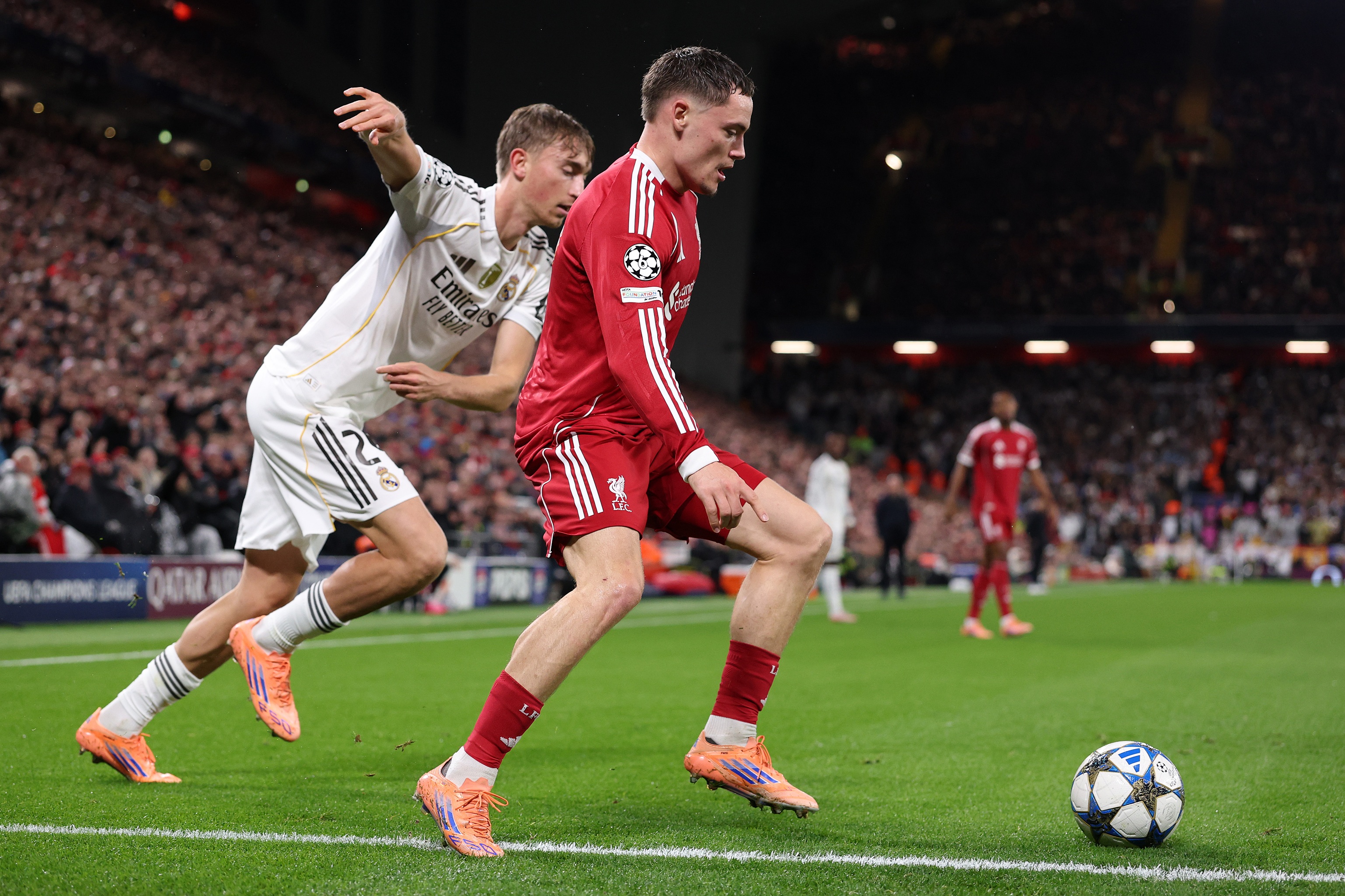 Florian Wirtz dribbles past Dean Huijsen.