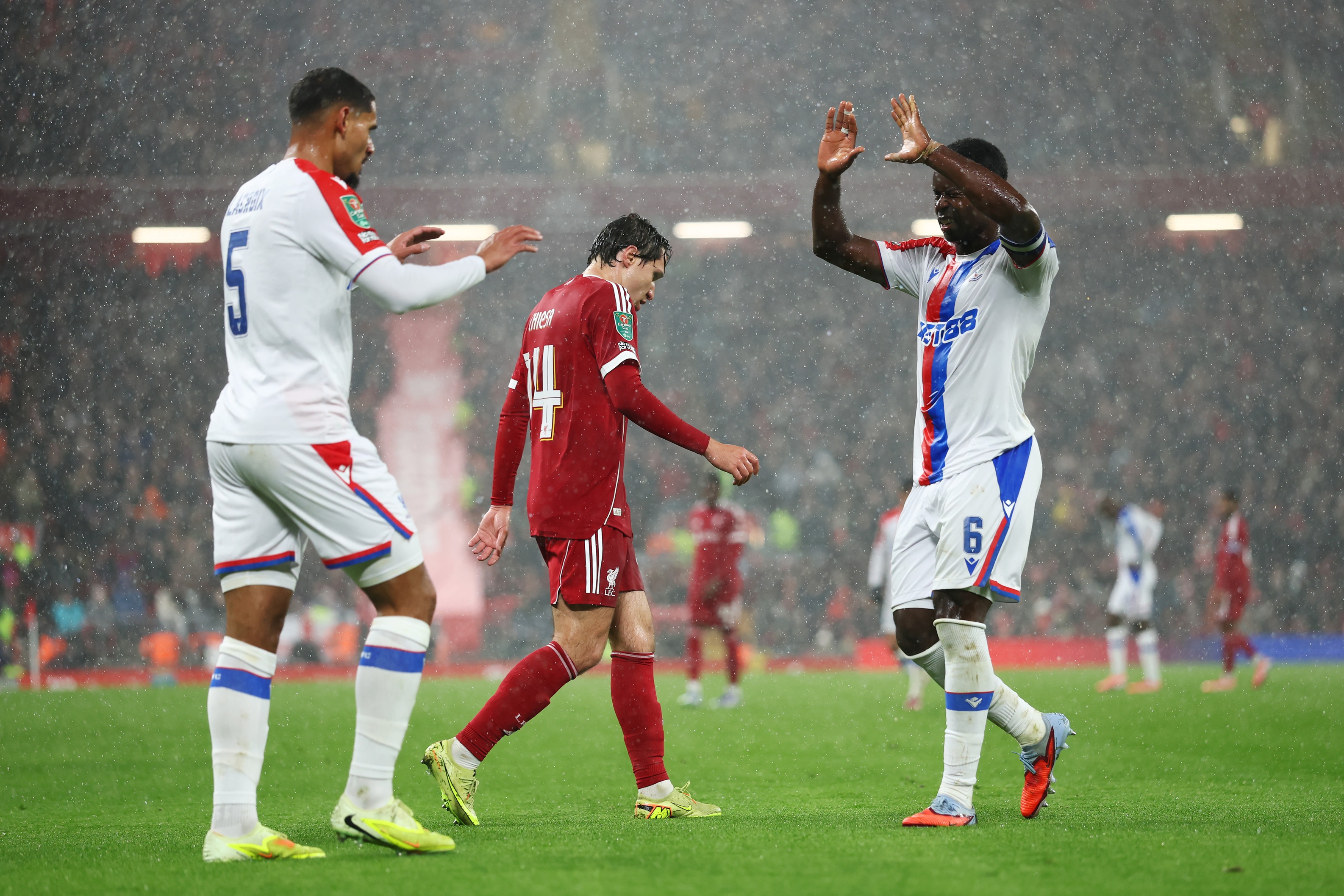 Marc Guehi high fives Maxence Lacroix during Liverpool vs Crystal Palace.