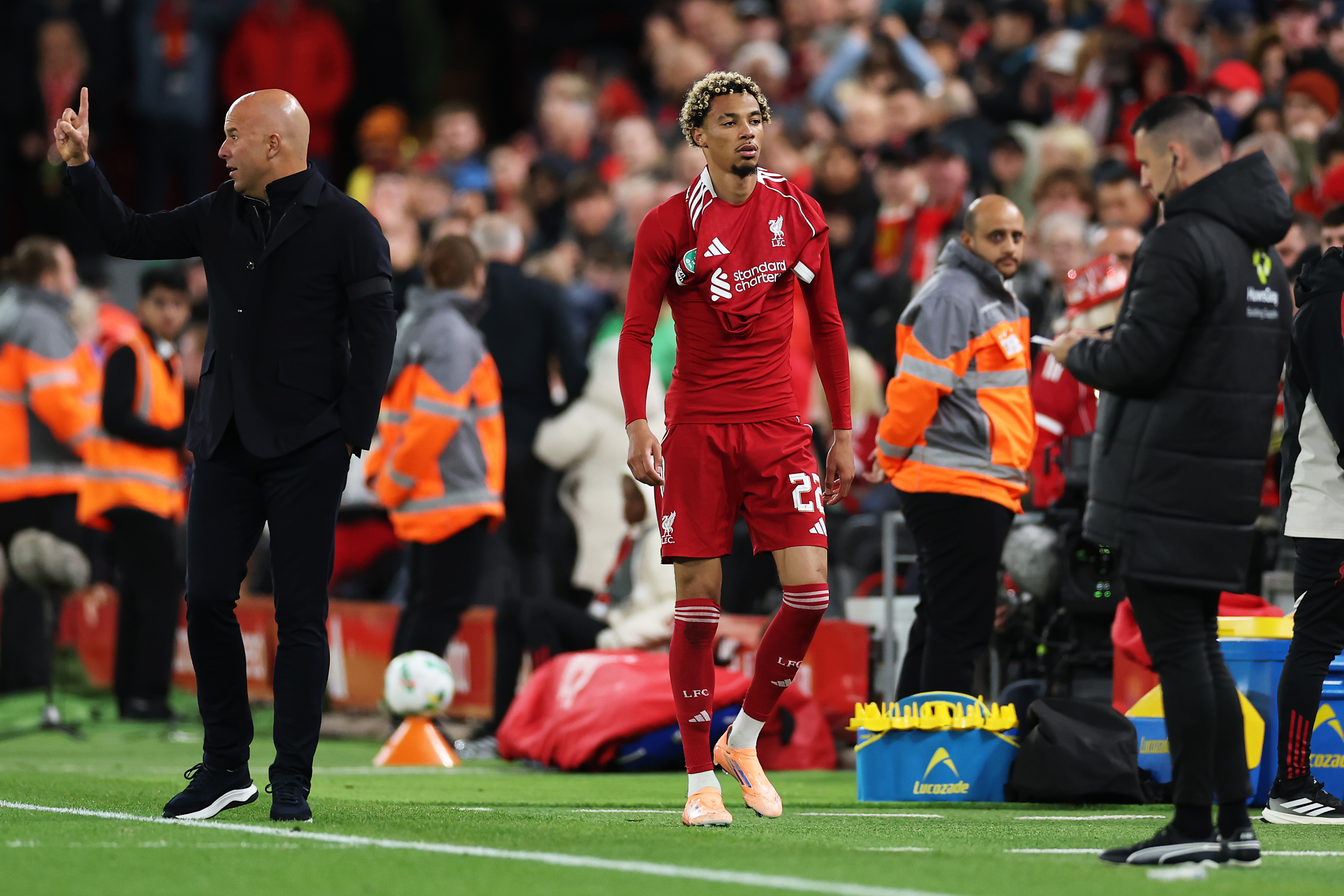 Hugo Ekitike walks past Arne Slot after being sent off against Southampton
