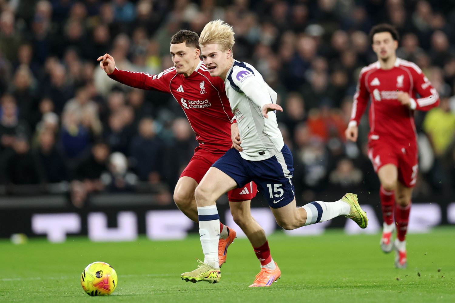 Lucas Bergvall of Tottenham Hotspur battles for possession with Florian Wirtz