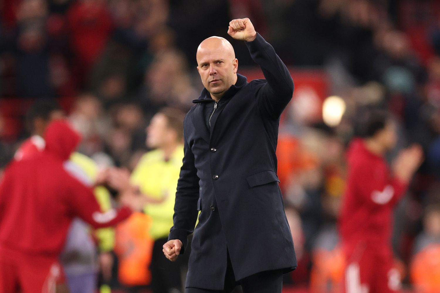 Arne Slot celebrates with Liverpool fans after Brighton