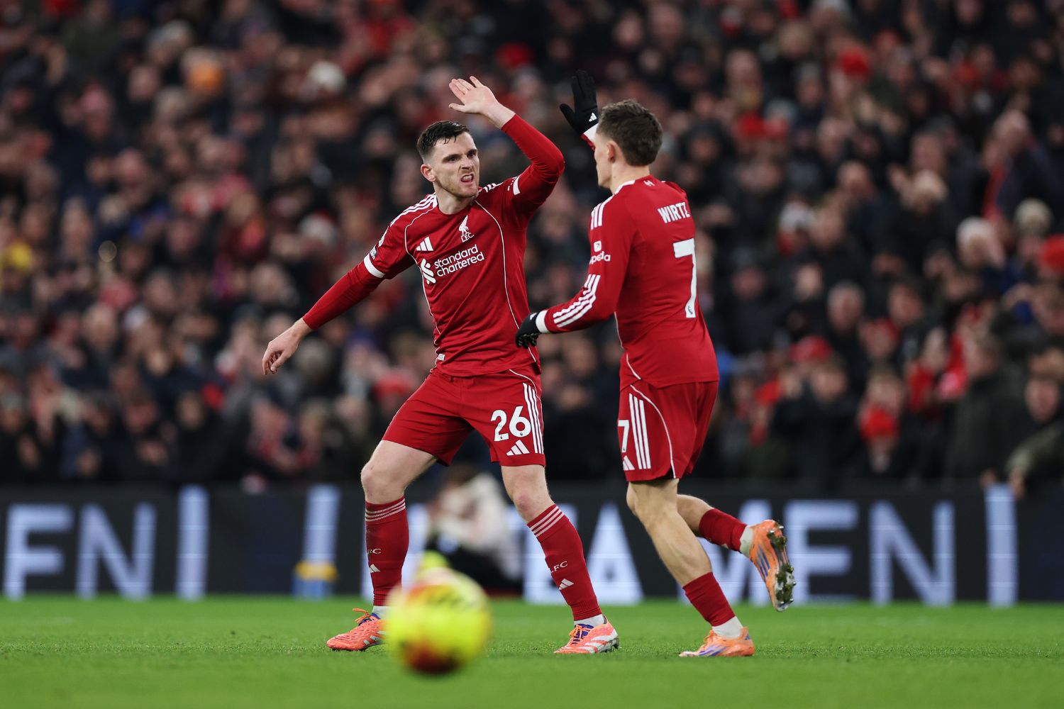 Andy Robertson and Florian Wirtz celebrate after scoring against Sunderland