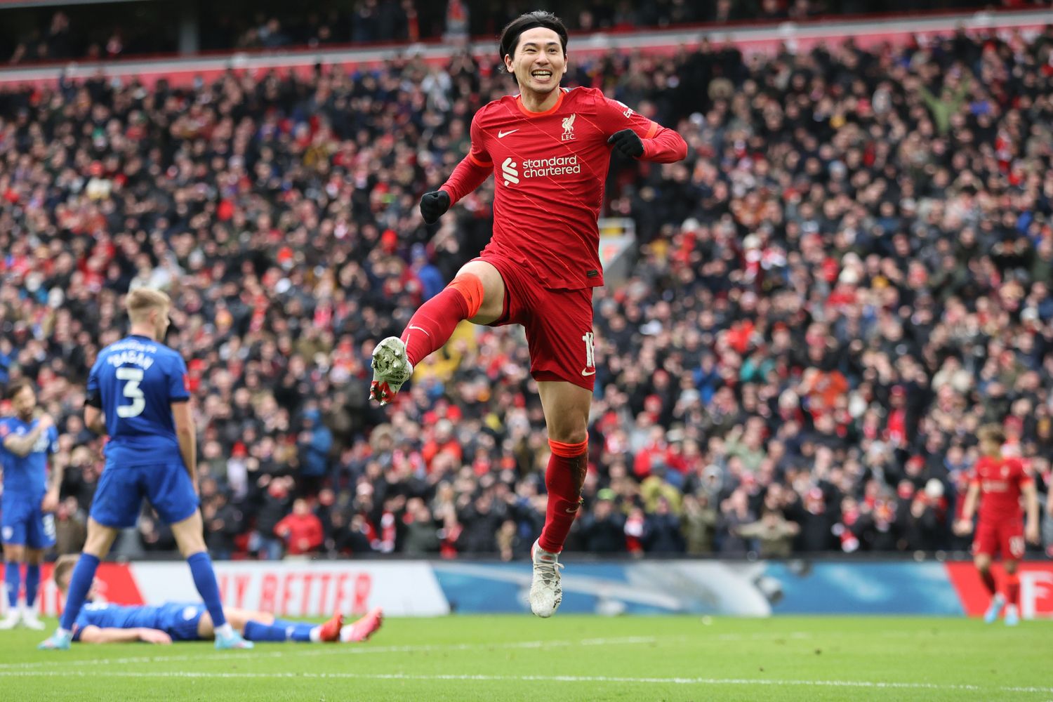 Takumi Minamino celebrates scoring for Liverpool in 2022