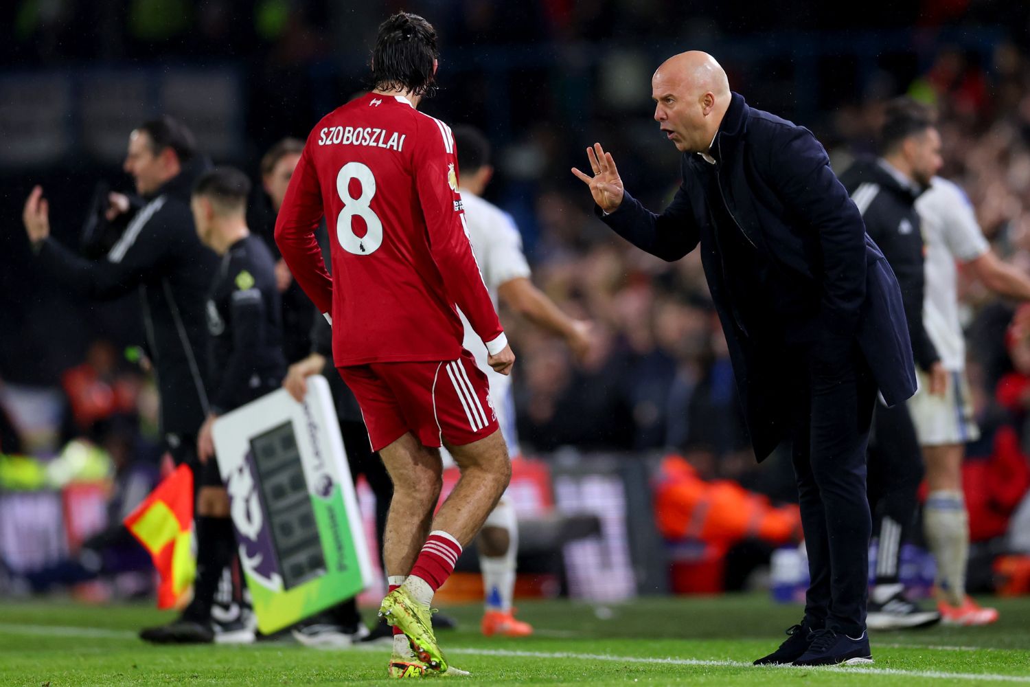 Dominik Szoboszlai talks with Arne Slot at Leeds