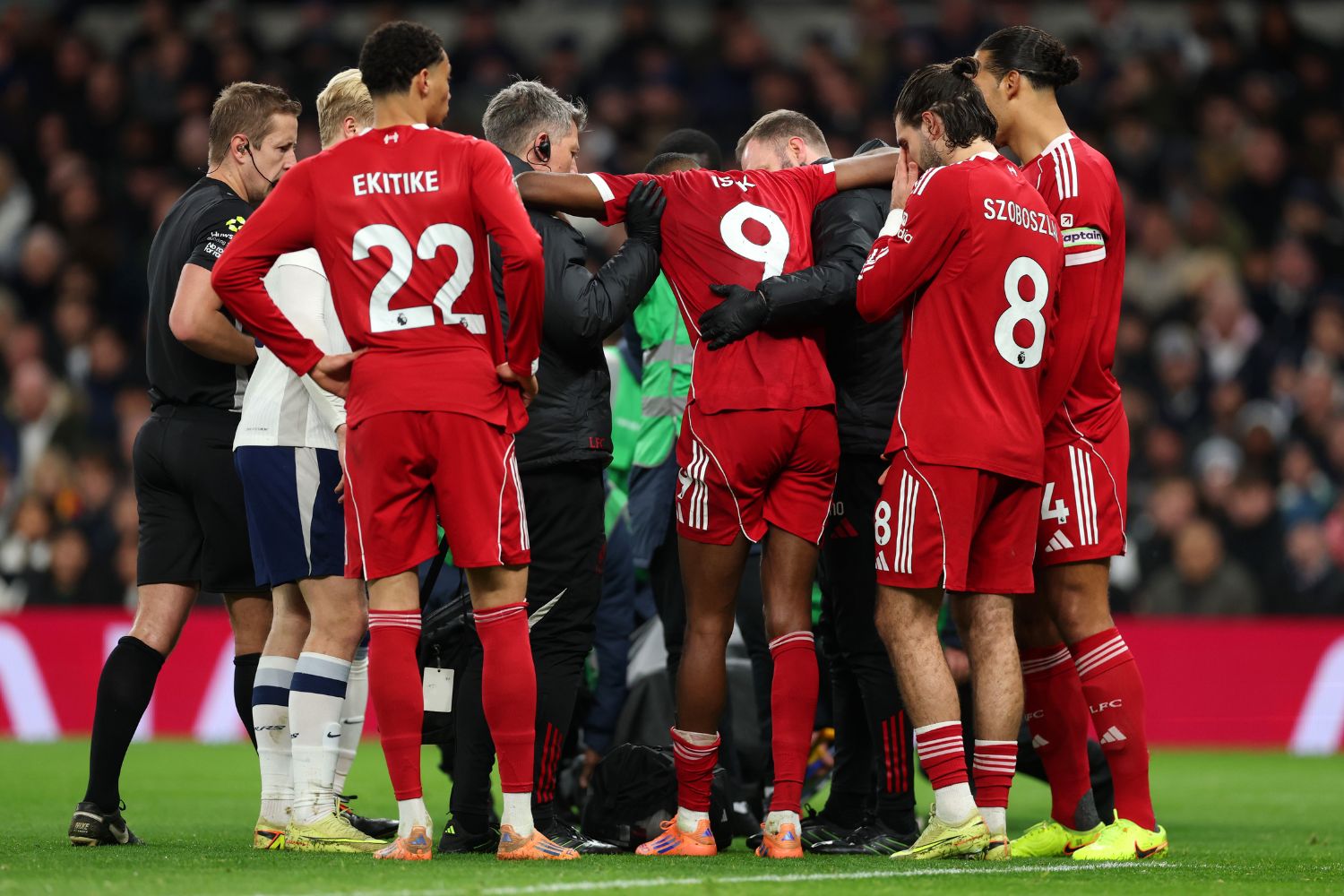 Alexander Isak helped to his feet after injury against Spurs