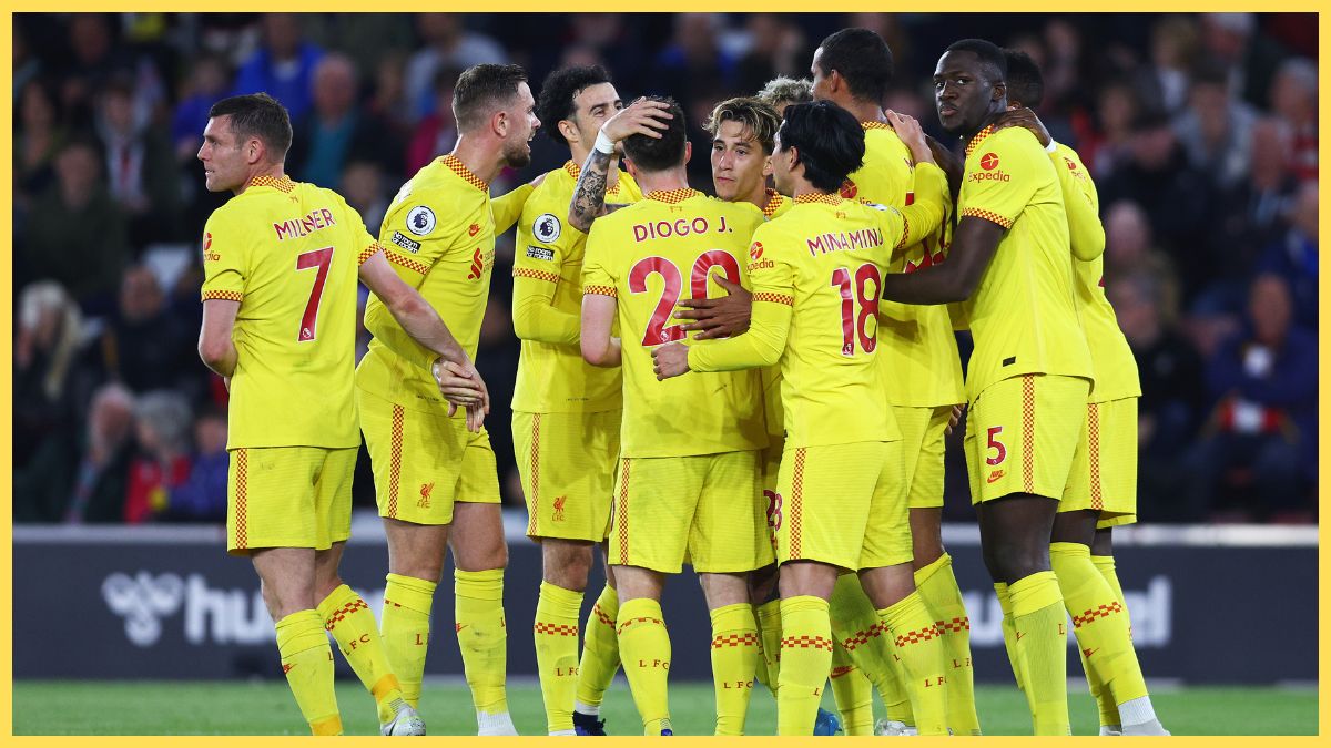 Takumi Minamino celebrates with Liverpool teammates in 2022