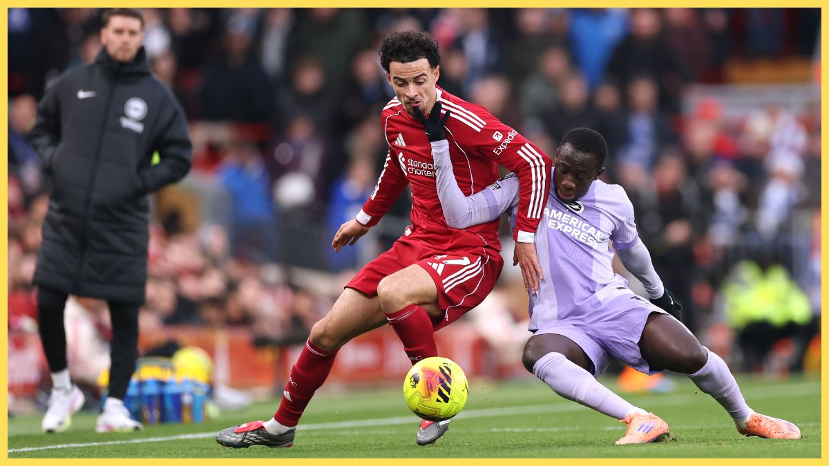 Curtis Jones of Liverpool is challenged by Yankuba Minteh of Brighton