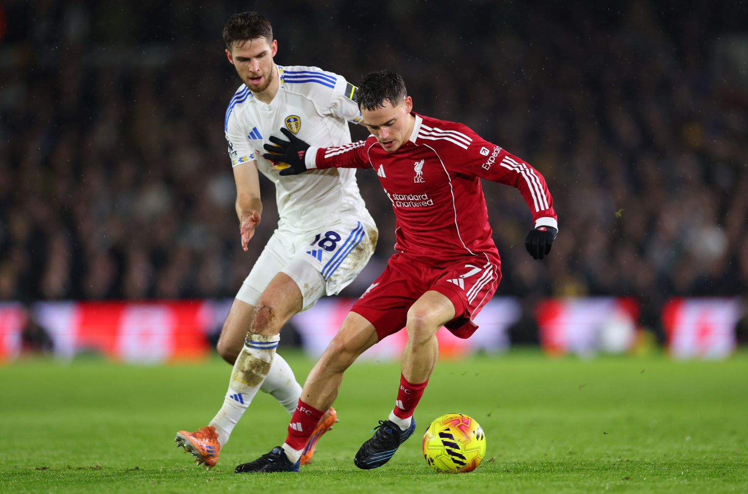 Florian Wirtz holds off Anton Stach during Liverpool's 3-3 draw at Leeds