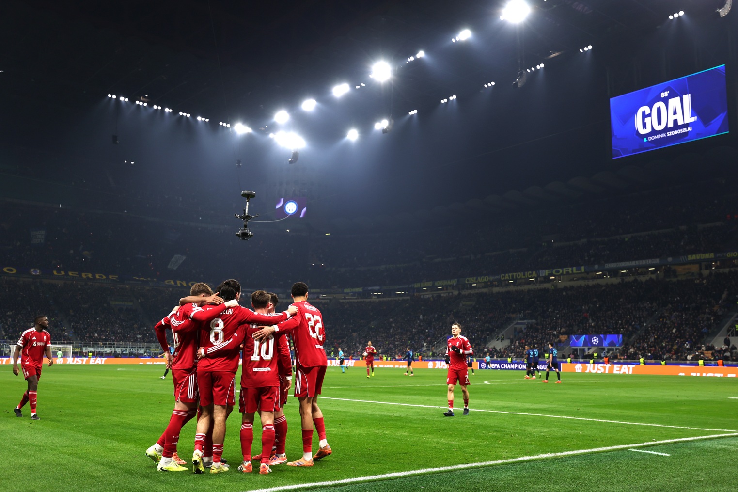 Liverpool players celebrate after Dominik Szoboszlai's late winner against Inter Milan