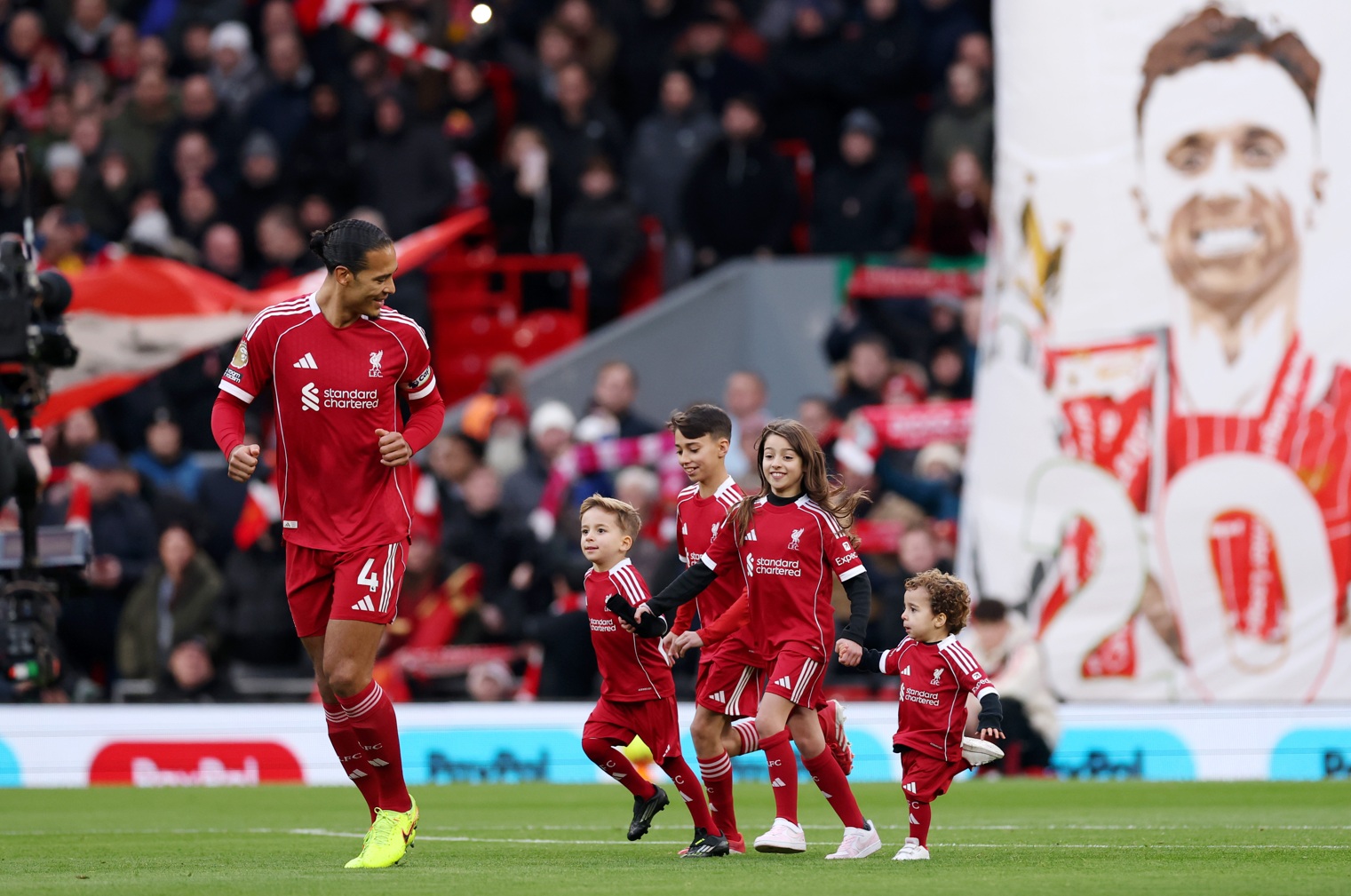Virgil van Dijk smiles towards the children of the late Diogo Jota before Liverpool's match against Wolves