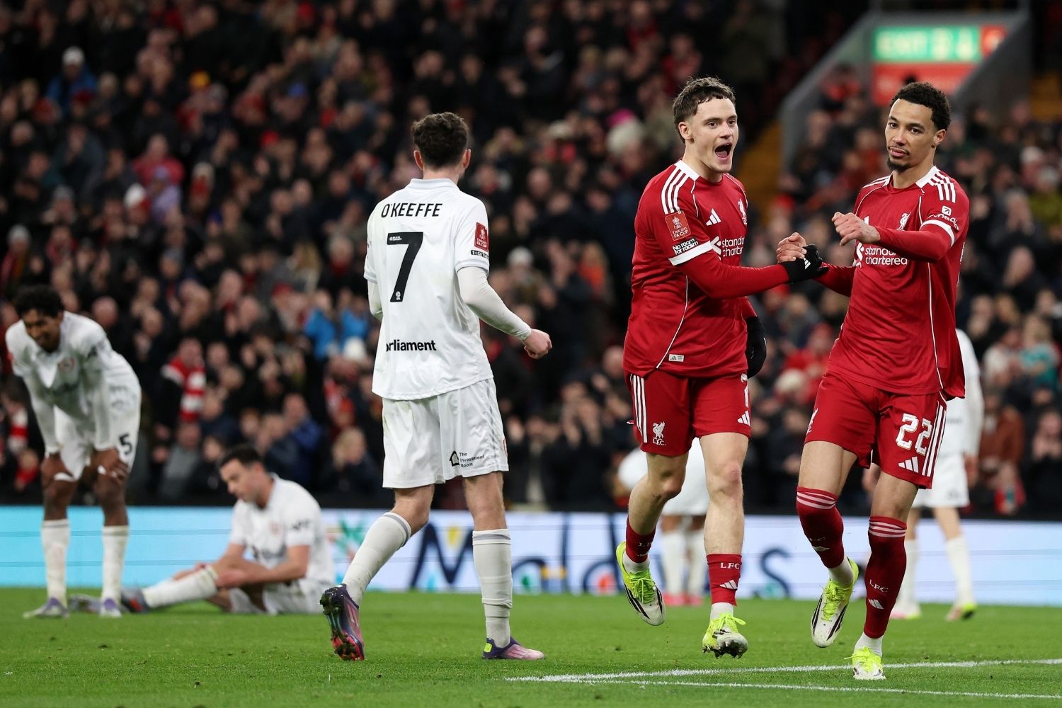 Liverpool's Florian Wirtz celebrates with teammate Hugo Ekitike after scoring his team's third goal during the Emirates FA Cup third round match between Liverpool and Barnsley