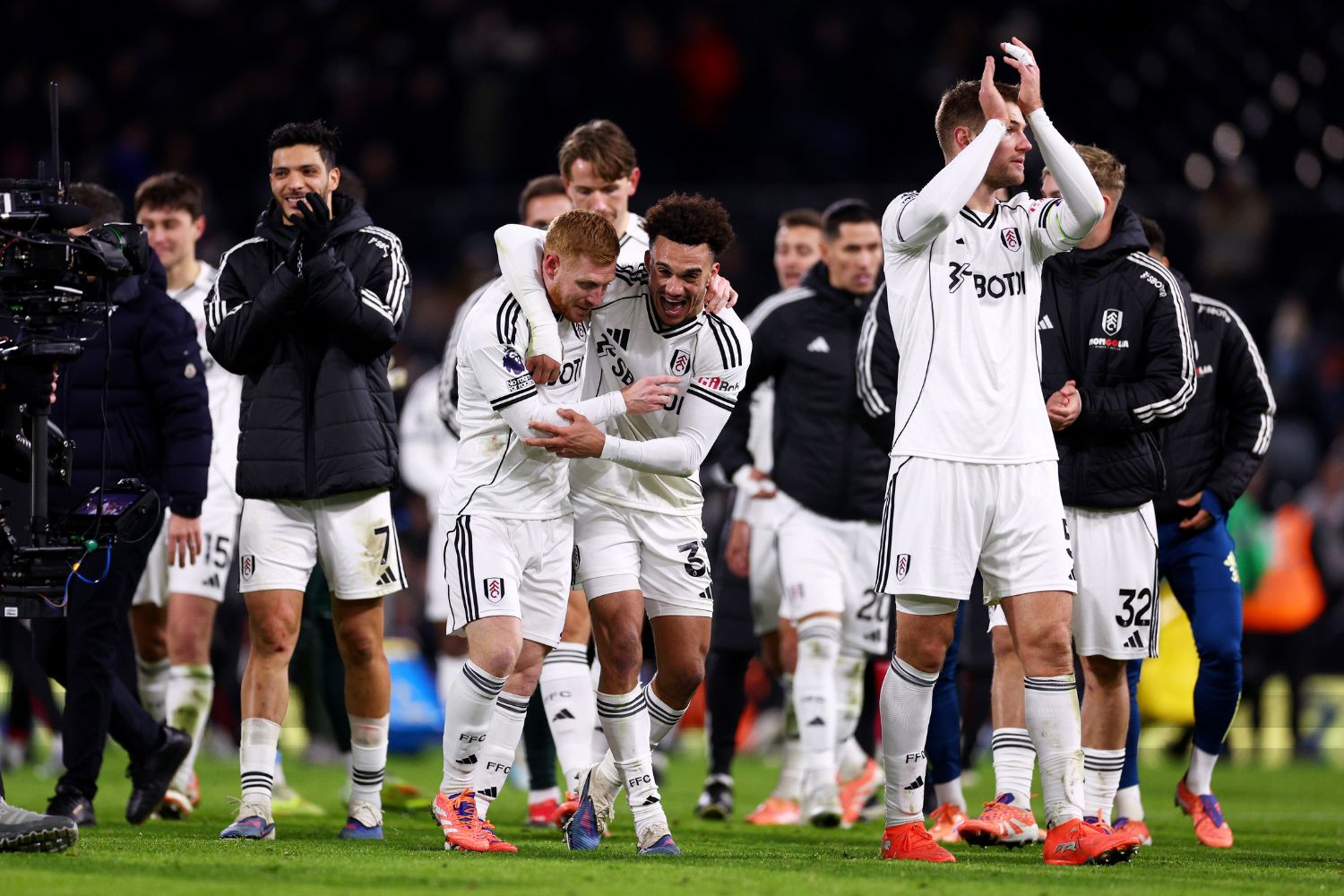 Fulham players celebrate a late draw against Liverpool