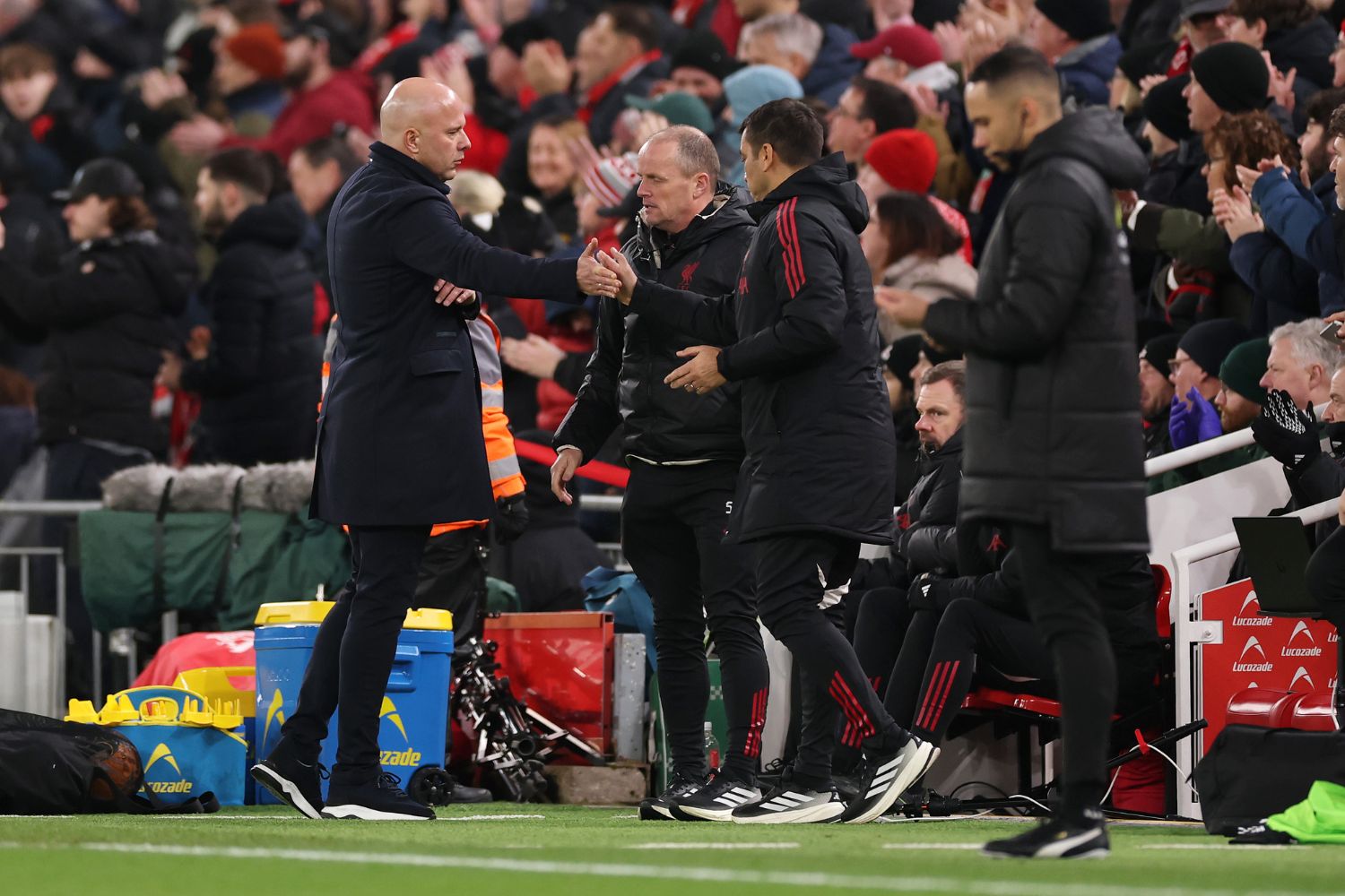 Arne Slot with Liverpool staff after beating Barnsley