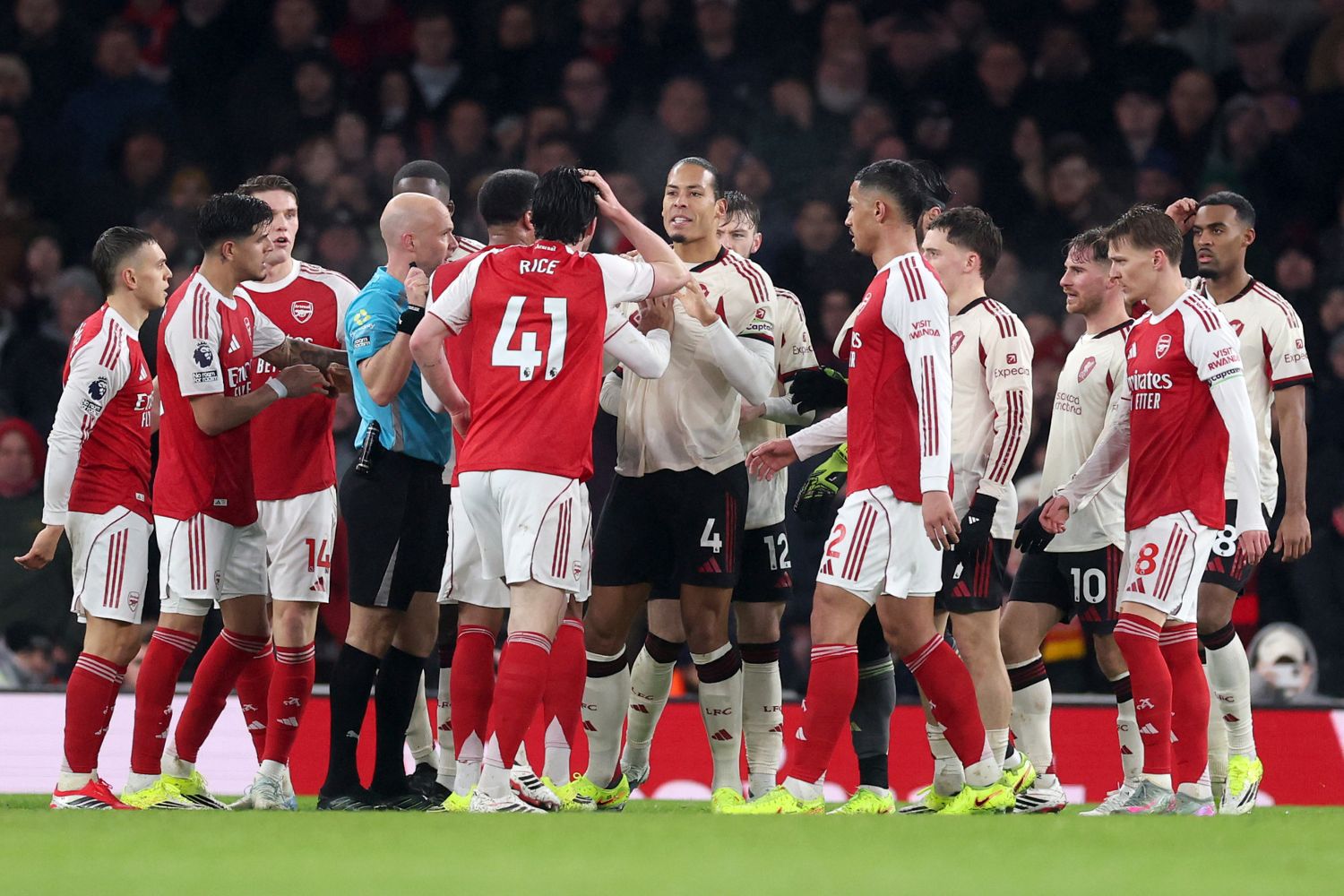 Virgil van Dijk of Liverpool remonstrates with Arsenal players