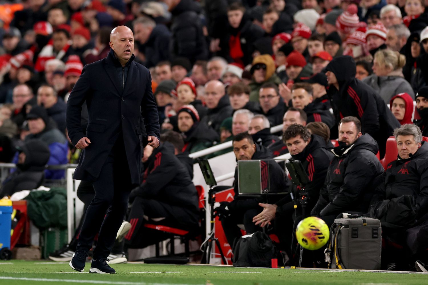 Arne Slot and his coaching staff against Leeds at Anfield