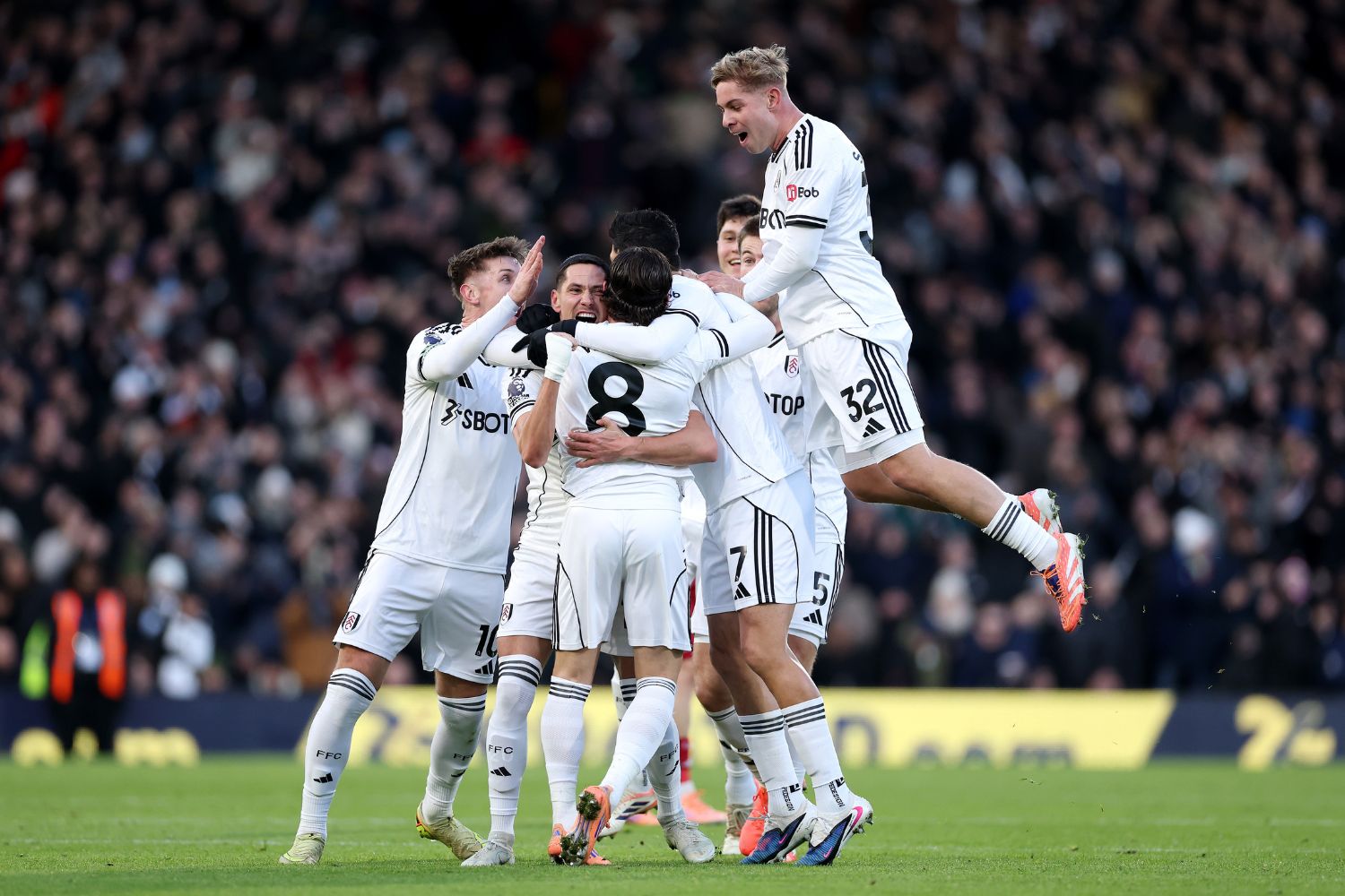 Fulham celebrate scoring against Liverpool