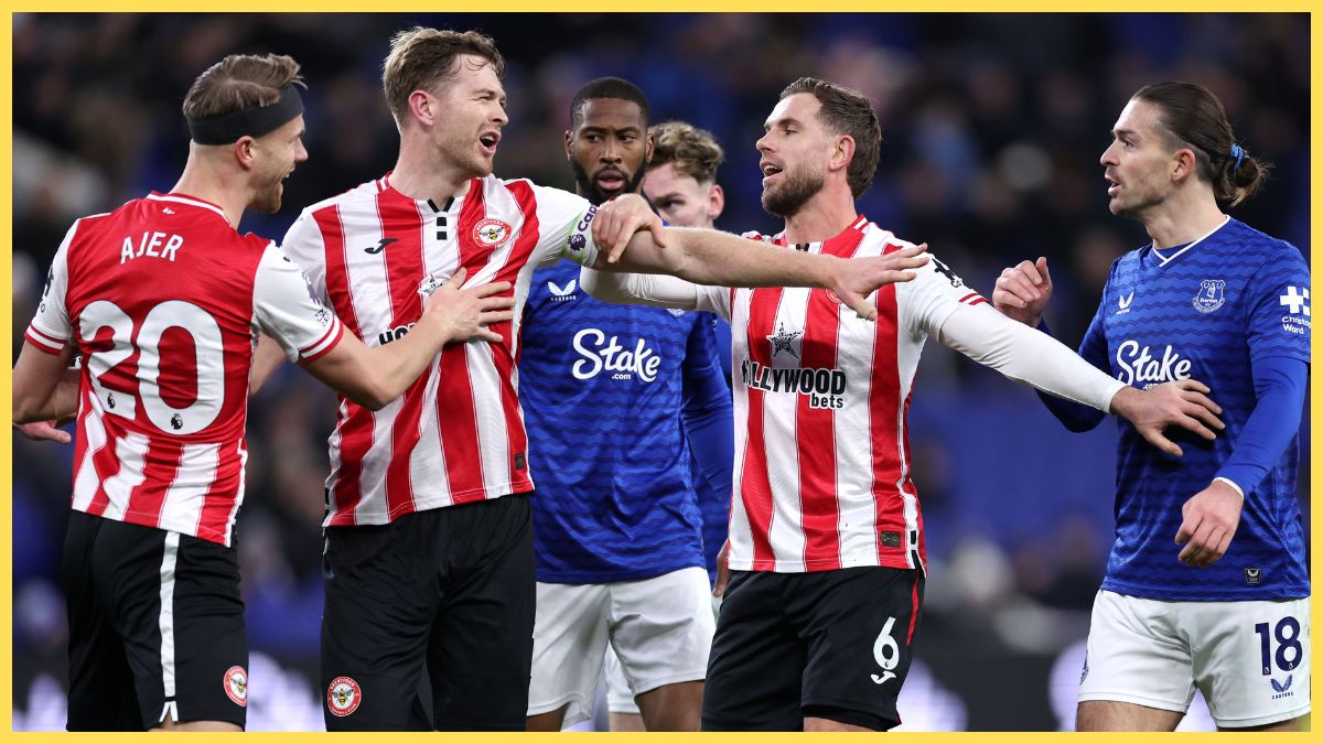 Jordan Henderson and Nathan Collins of Brentford clash with Jack Grealish of Everton