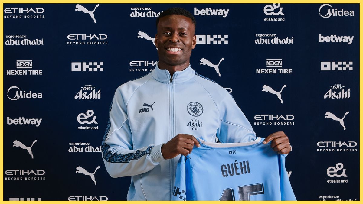 Marc Guehi poses as a Manchester City player