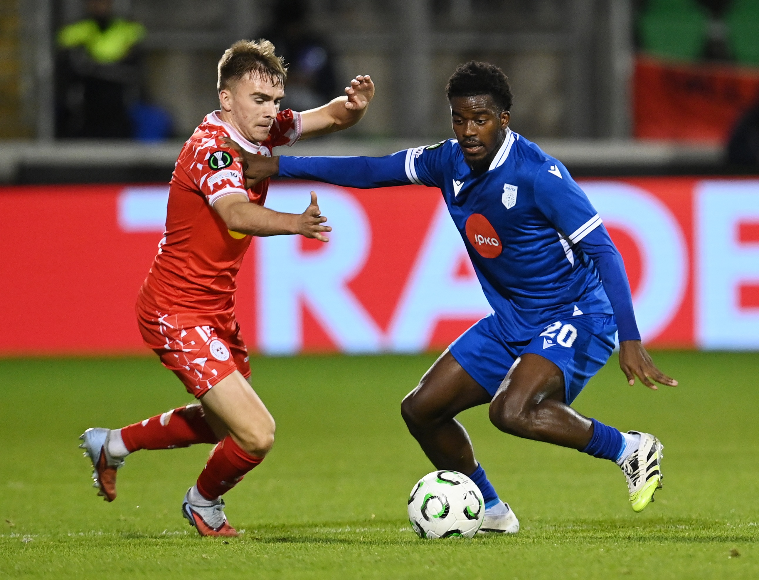 James Norris competes for the ball with Mamadou Soumahoro.