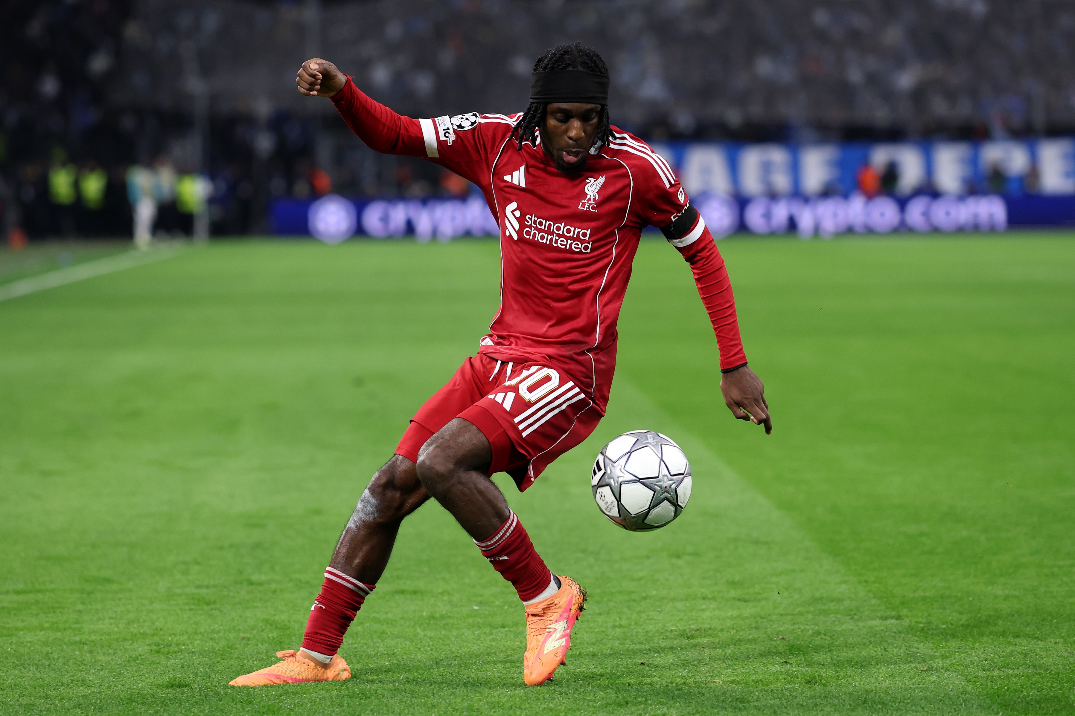 Jeremie Frimpong controls a football during a Liverpool game.