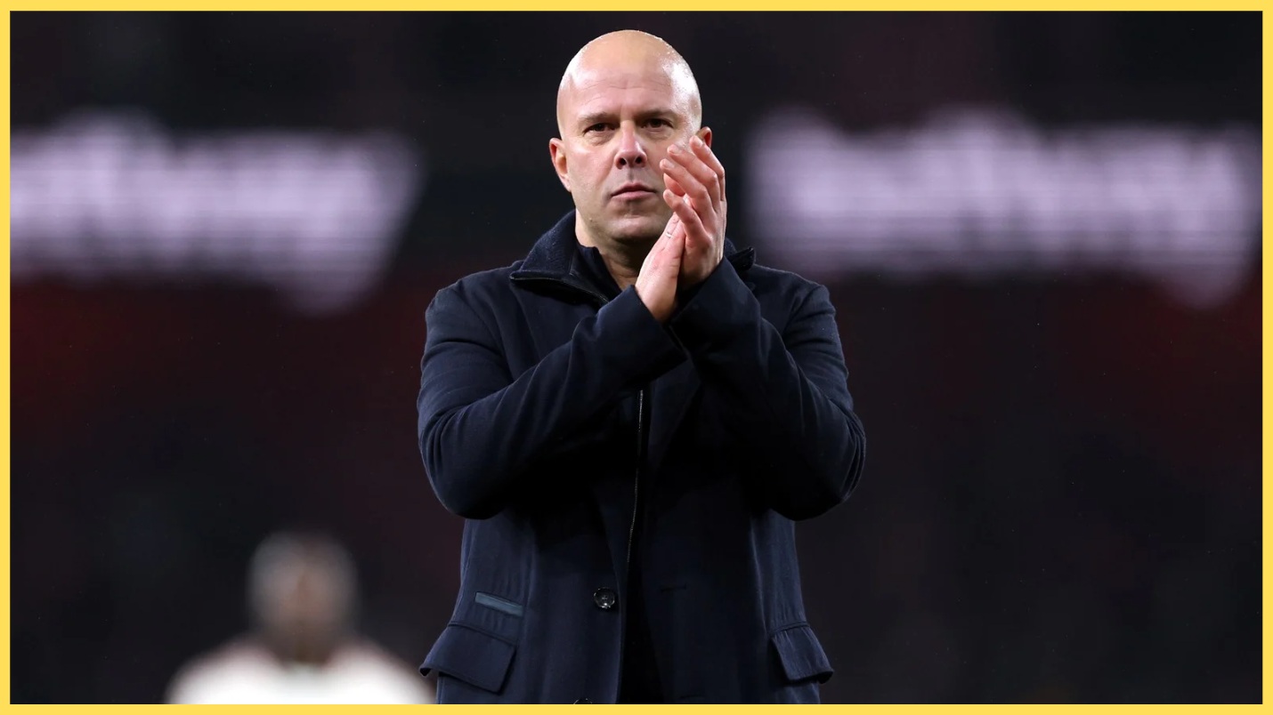 Arne Slot applauds the travelling Liverpool fans after the 0-0 draw at Arsenal