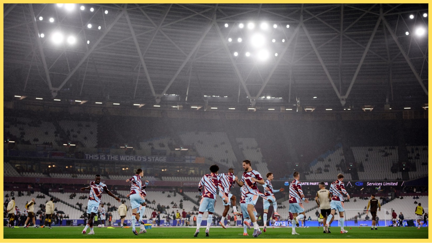Michael Kayode warms up with his Brentford teammates