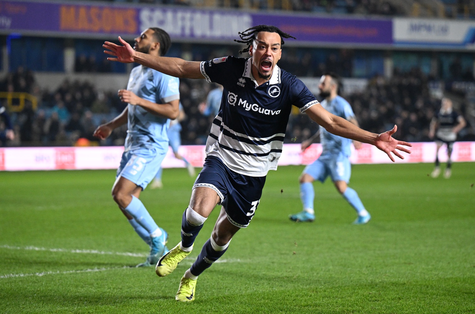 Calum Scanlon celebrates scoring for Millwall during his loan spell from Liverpool in 2025