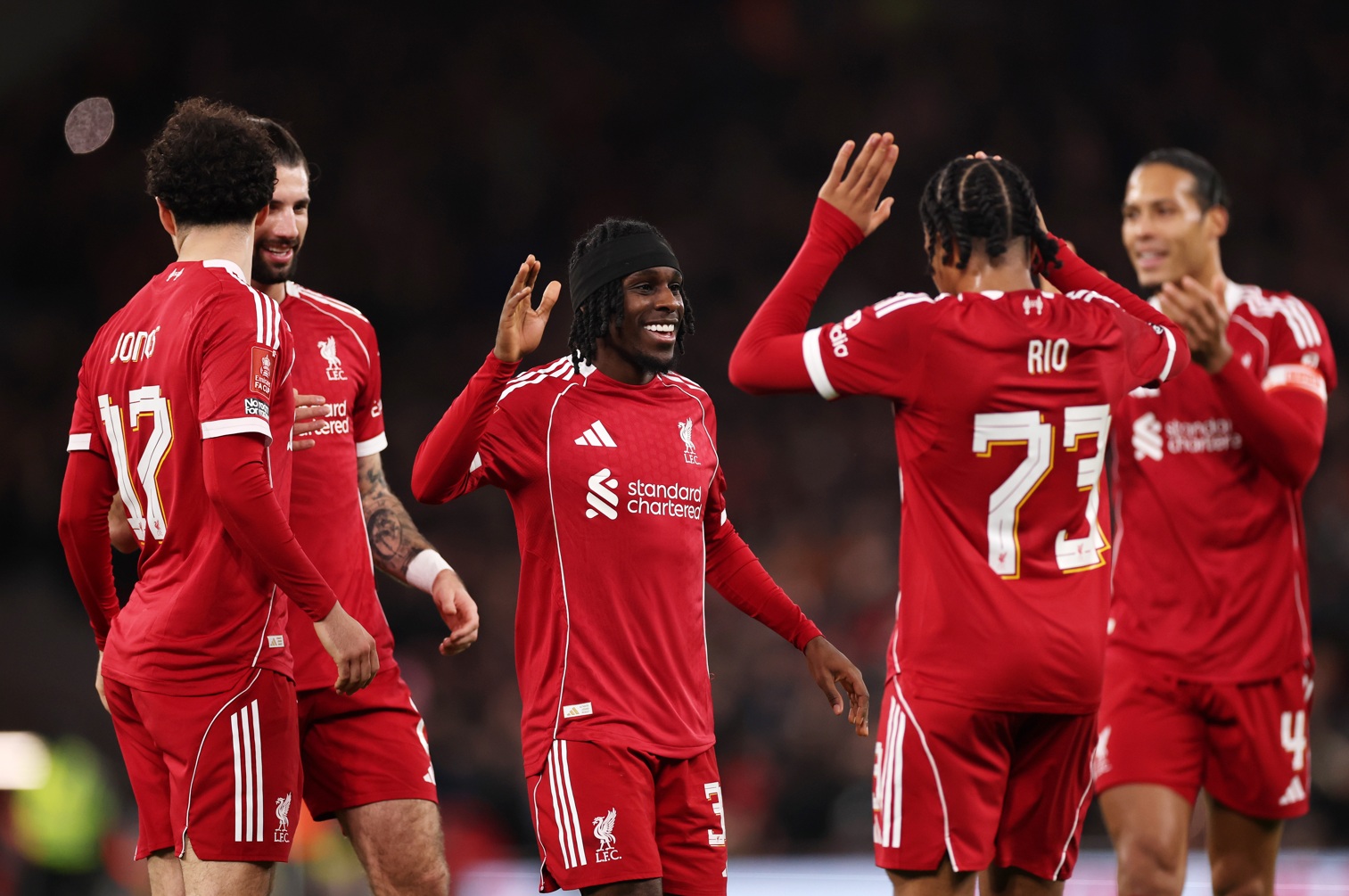 Liverpool players celebrate with Jeremie Frimpong after his goal against Barnsley