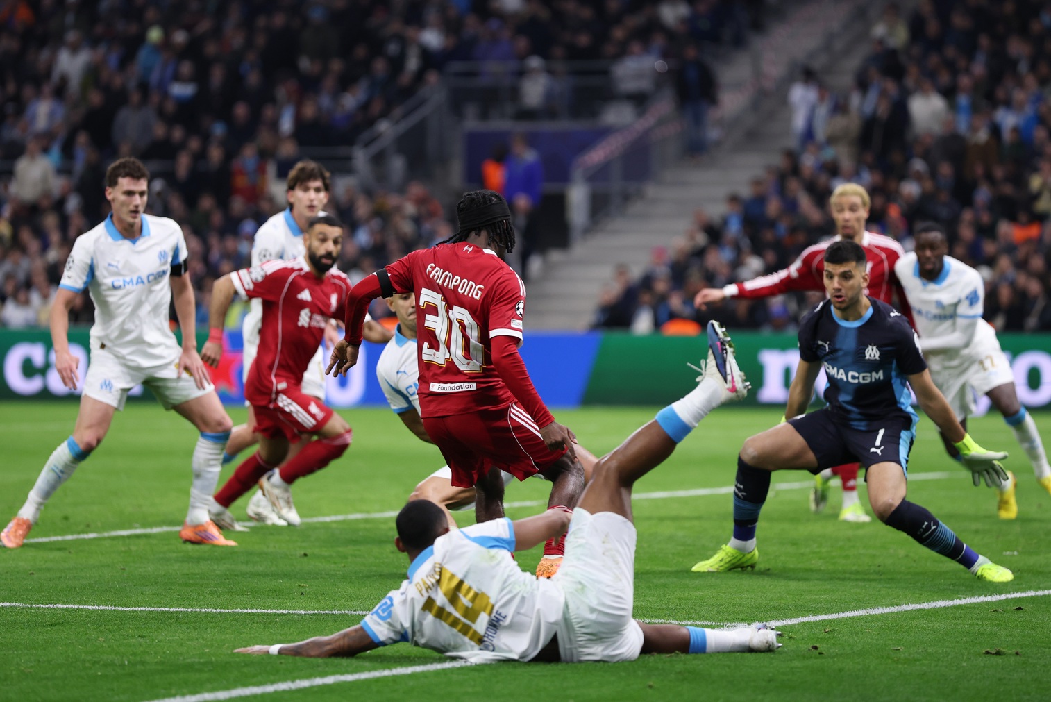 Jeremie Frimpong plays the ball off Geronimo Rulli and into the Marseille net