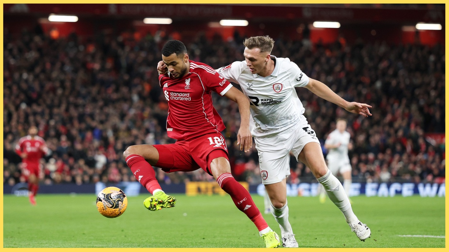 Cody Gakpo is closed down by Barnsley's Jack Shepherd
