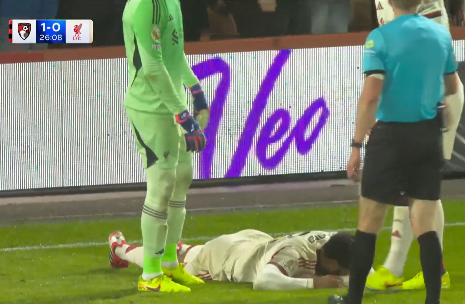 Joe Gomez lies injured after Alisson Becker collided into him in trying to prevent Evanilson from scoring
