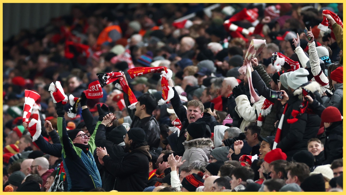 Liverpool fans celebrate a goal at Anfield