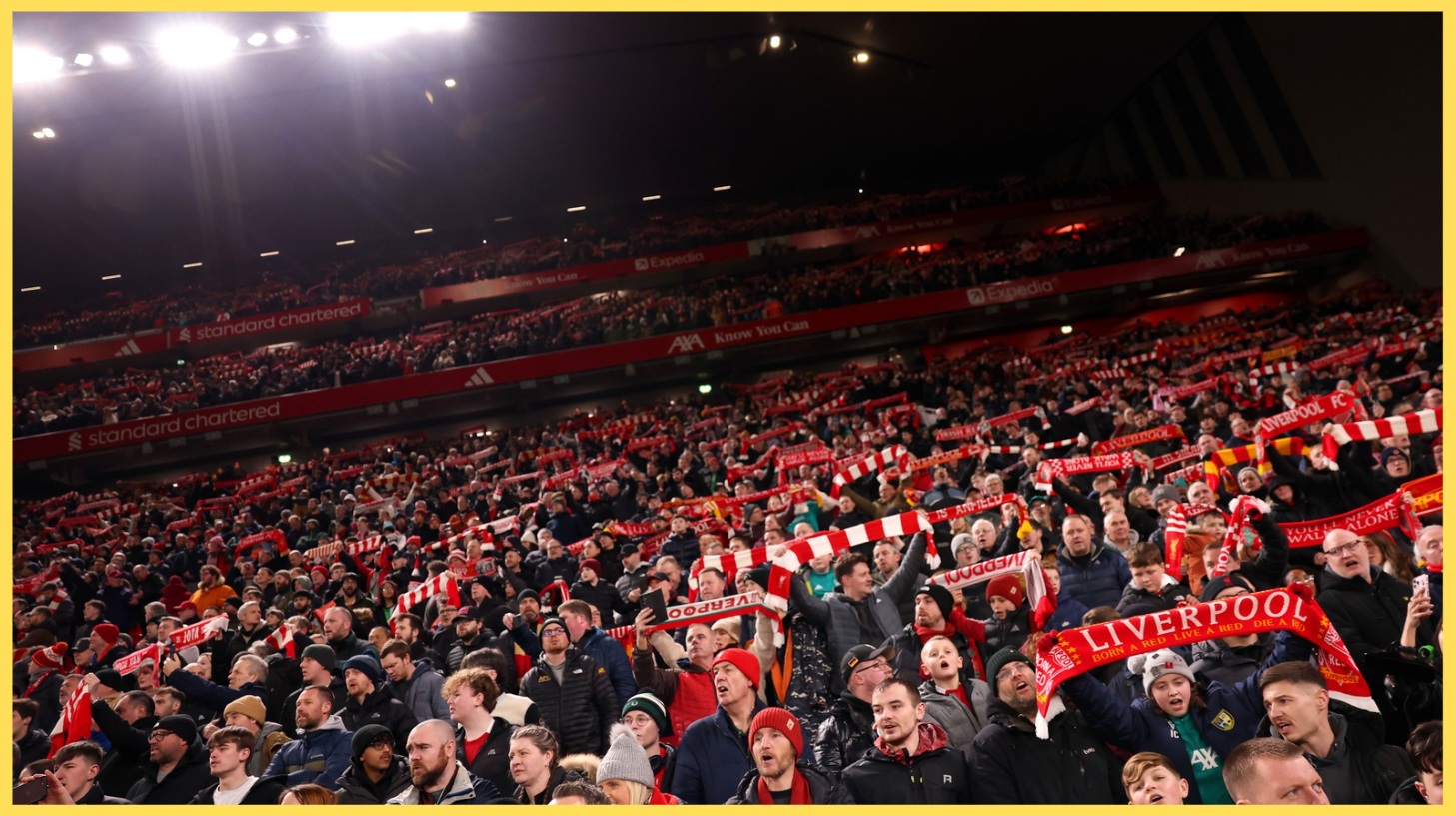 Liverpool fans hold scarves aloft prior to the FA Cup win over Barnsley