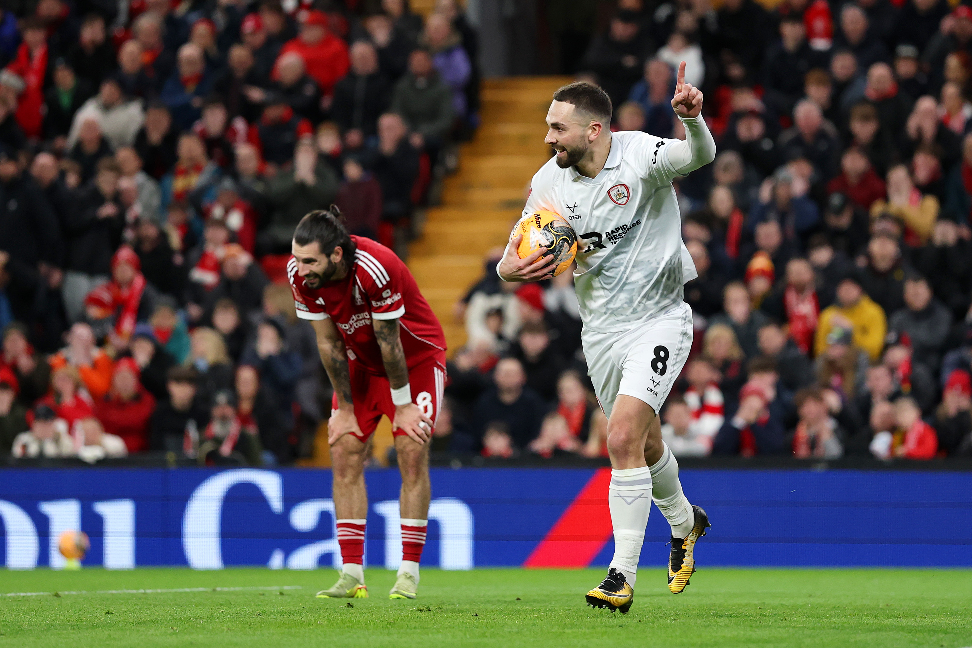 Adam Phillips celebrates his goal against Liverpool after a costly misjudgement from Dominik Szoboszlai
