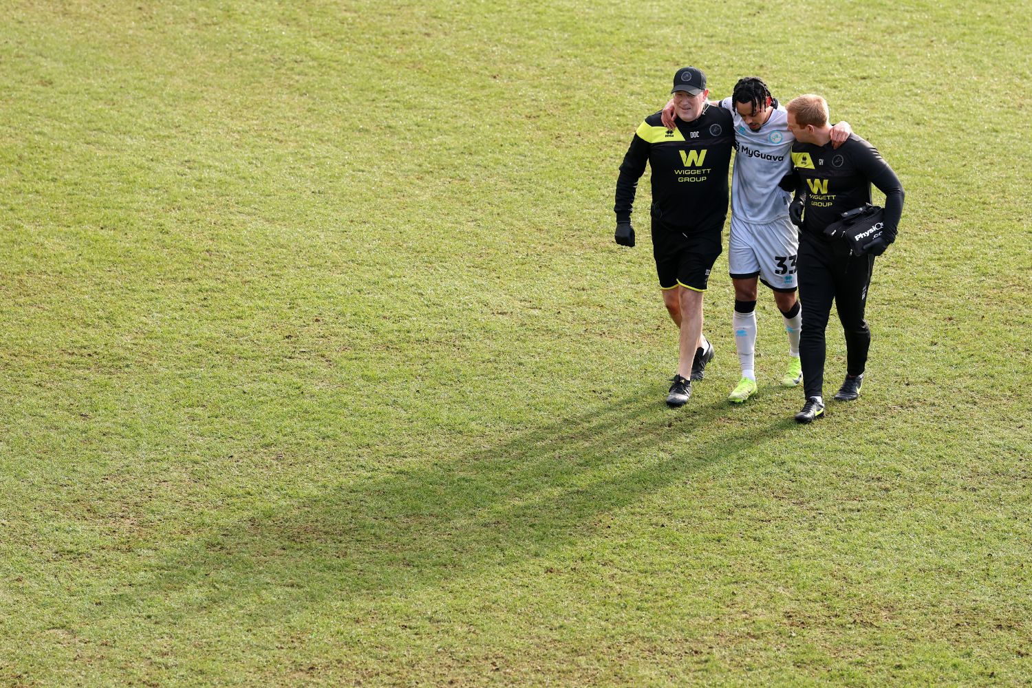 Calum Scanlon of Millwall leaves the field after suffering an injury