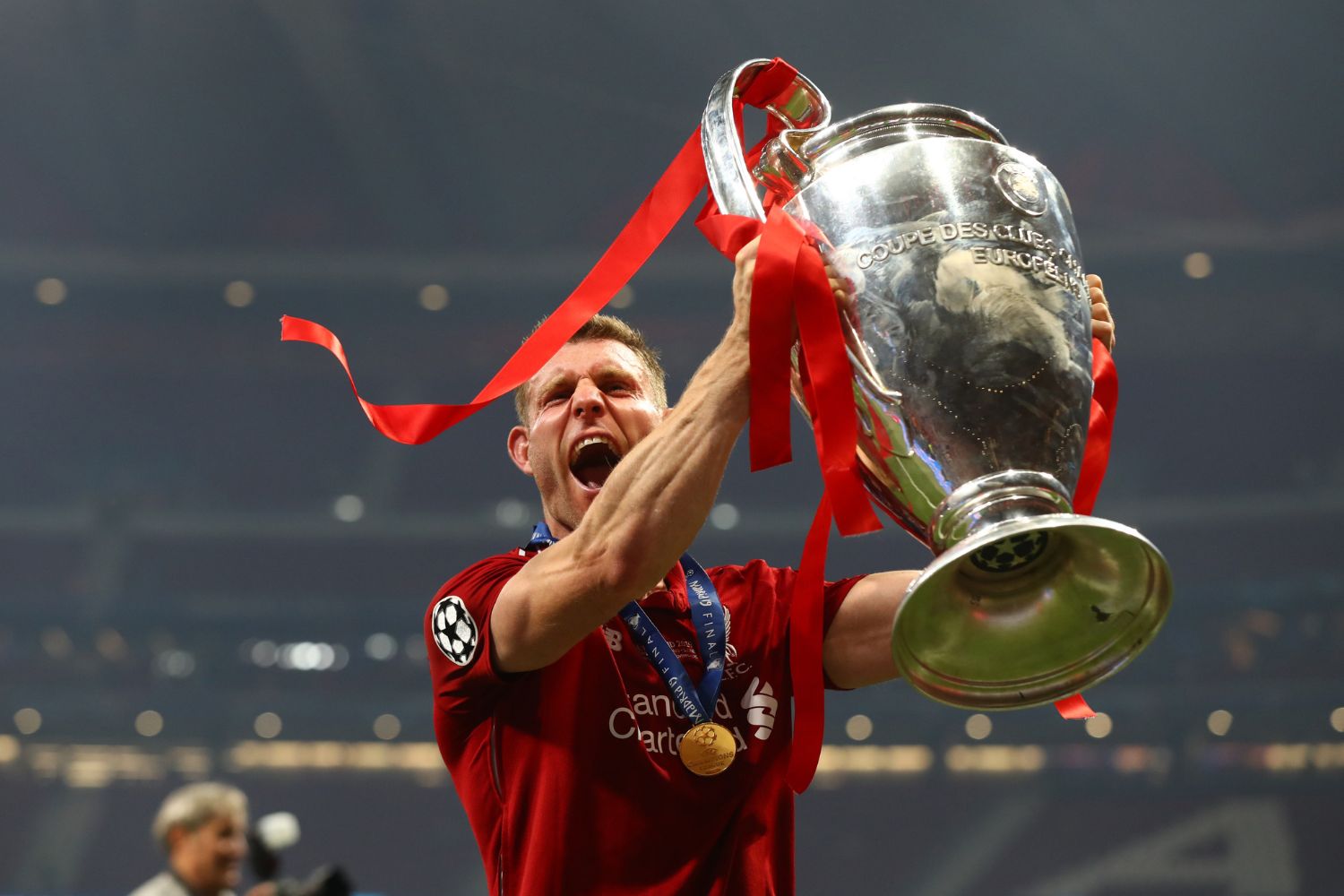 James Milner celebrates with the European Cup in 2019