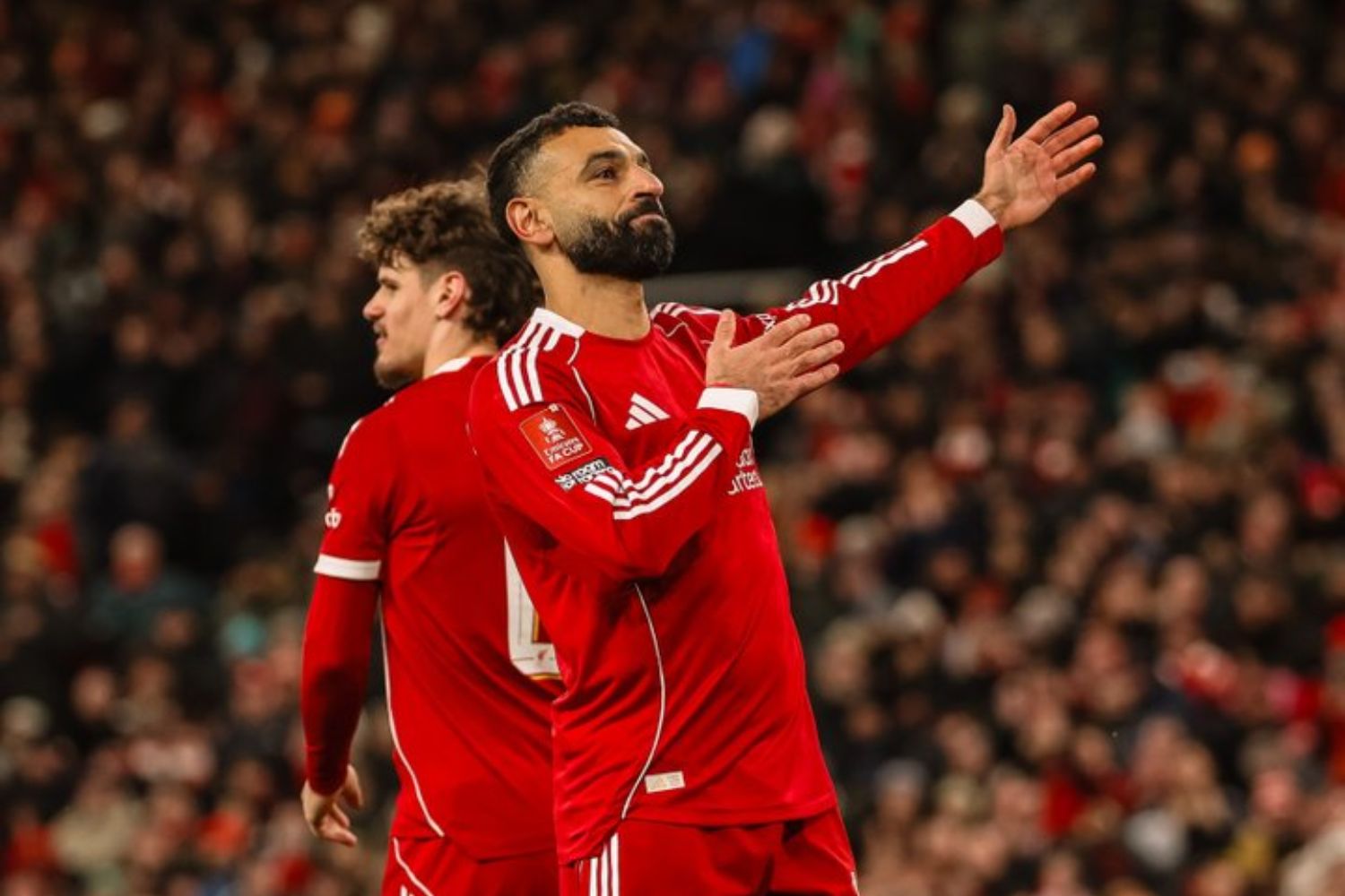 Mo Salah celebrates scoring against Brighton