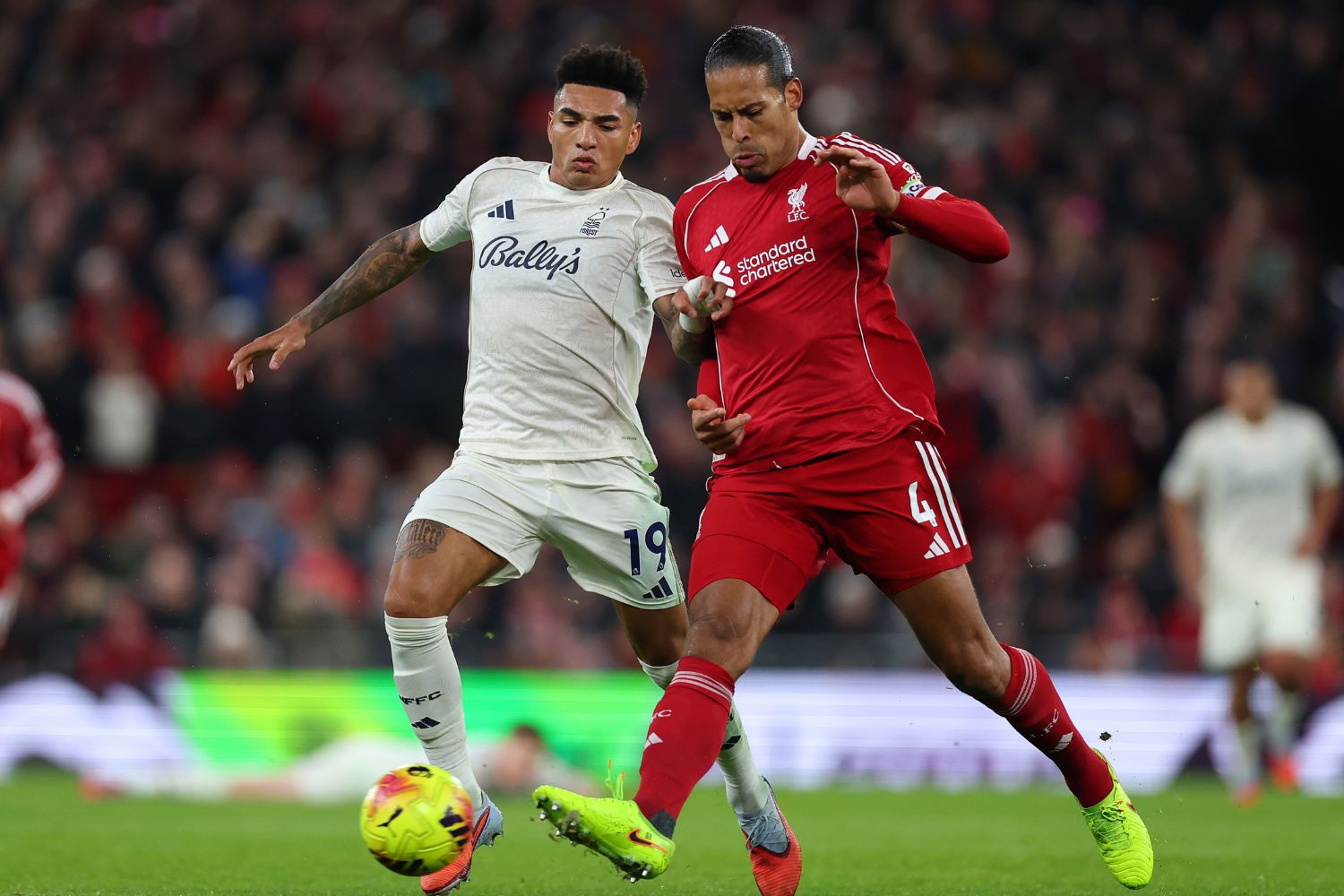 Igor Jesus of Nottingham Forest in action with Virgil van Dijk of Liverpool