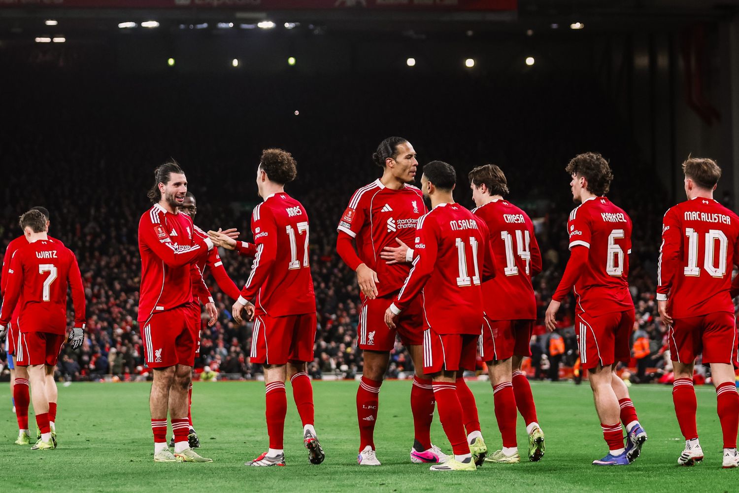 Liverpool players celebrate after scoring against Brighton