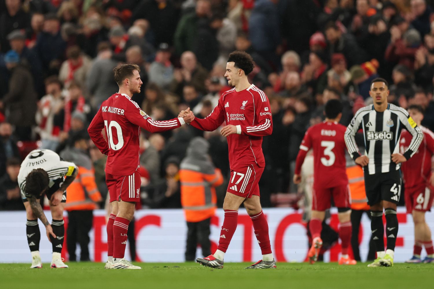 Alexis Mac Allister and Curtis Jones of Liverpool celebrate victory following the Premier League match between Liverpool and Newcastle United