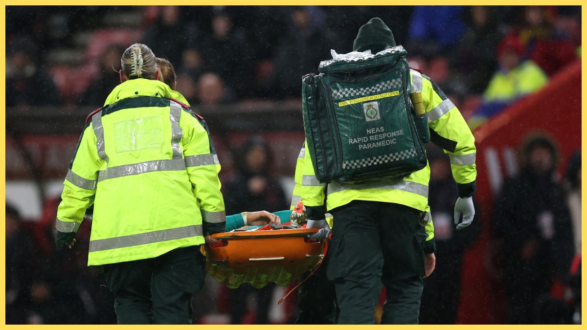 Wataru Endo of Liverpool is stretched off the pitch against Sunderland
