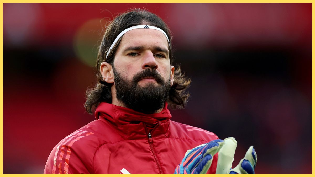 Alisson Becker of Liverpool warms up