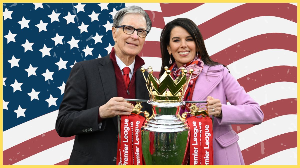 John W. Henry, Principle Owner of Liverpool and his wife Linda Pizzuti Henry pose for a photograph with the Premier League trophy