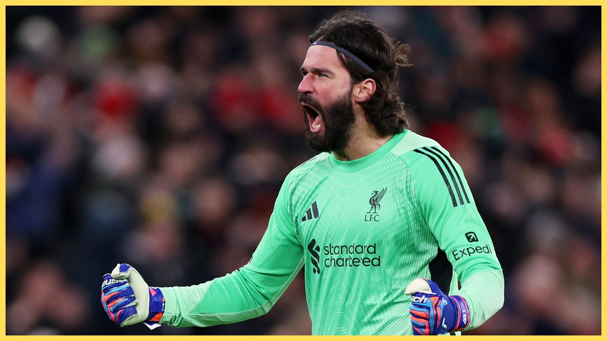 Alisson Becker of Liverpool celebrates after Dominik Szoboszlai of Liverpool (not pictured) scores his team's second goal during the Emirates FA Cup Fourth Round match between Liverpool and Brighton