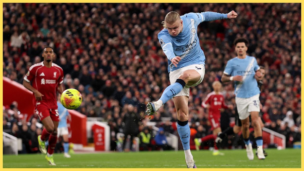 Ryan Gravenberch looks on as Erling Haaland has a shot at Anfield